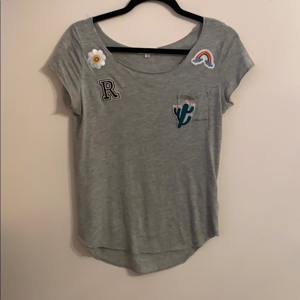 grey shirt with colorful patches